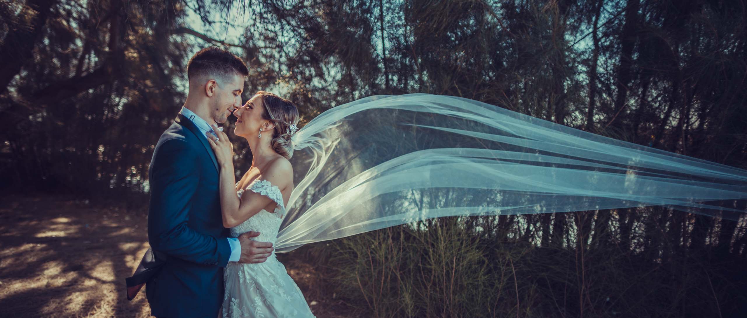 Nicole and Matt Blowing Veil
